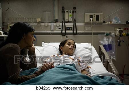 Mother watching daughter in hospital bed sleep View Large Photo Image Stock Photography - Mother watching daughter in hospital bed sleep. Fotosearch