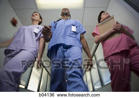 Nurses walking View Large Photo Image Stock Photograph - Nurses walking. Fotosearch