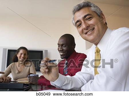 Stock Photo - Older Businessman at meeting. Fotosearch