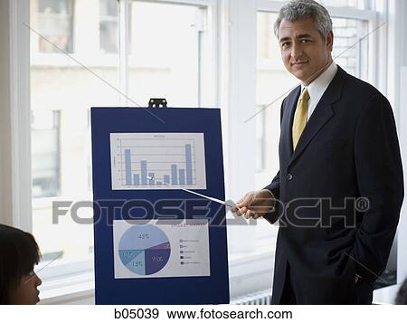 Stock Photo - Older businessman making presentation. Fotosearch