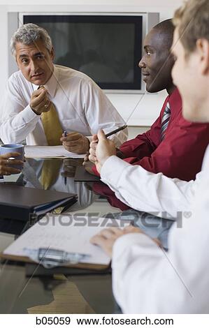 Older businessman talking at business meeting View Large Photo Image Stock Photo - Older businessman talking at business meeting. Fotosearch