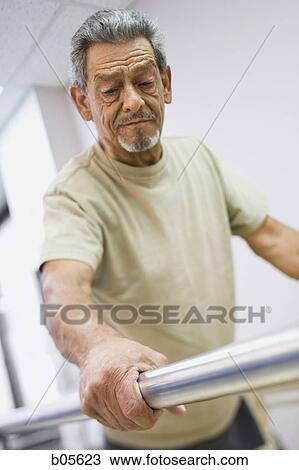 Older man walking with assistance in therapy View Large Photo Image Stock Image - Older man walking with assistance in therapy. Fotosearch
