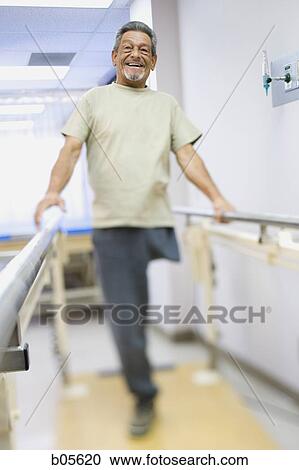 Older man with one leg exercising and smiling View Large Photo Image Stock Image - Older man with one leg exercising and smiling. Fotosearch