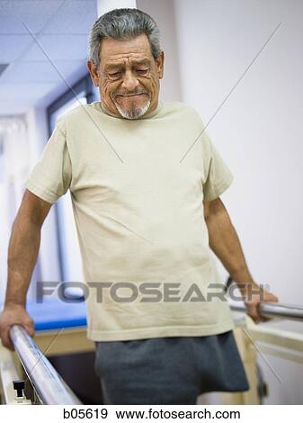 Older man with one leg walking View Large Photo Image Stock Photo - Older man with one leg walking. Fotosearch