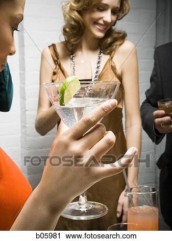 Partygoers socializing View Large Photo Image Stock Image - Partygoers socializing. Fotosearch
