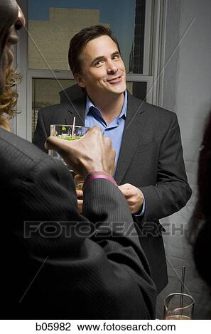 Partygoers socializing View Large Photo Image Stock Image - Partygoers socializing. Fotosearch