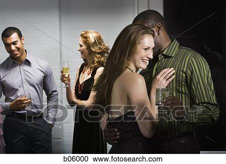 Partygoers socializing View Large Photo Image Stock Image - Partygoers socializing. Fotosearch