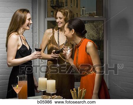 Partygoers socializing View Large Photo Image Stock Photograph - Partygoers socializing. Fotosearch