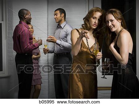 Partygoers socializing View Large Photo Image Stock Photography - Partygoers socializing. Fotosearch