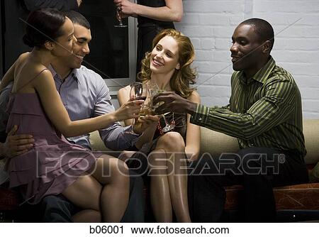 Partygoers toasting View Large Photo Image Stock Image - Partygoers toasting. Fotosearch