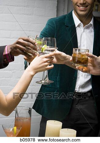 Partygoers toasting View Large Photo Image Stock Photo - Partygoers toasting. Fotosearch