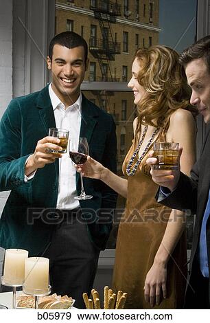 Partygoers toasting View Large Photo Image Stock Photo - Partygoers toasting. Fotosearch