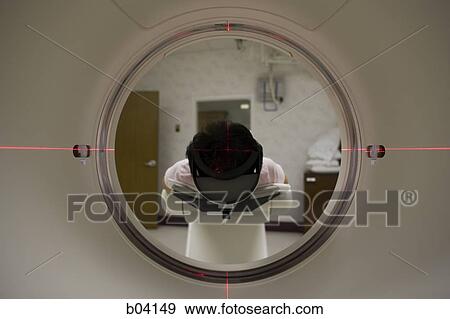 Patient entering MRI machine from behind View Large Photo Image Stock Photo - Patient entering MRI machine from behind. Fotosearch
