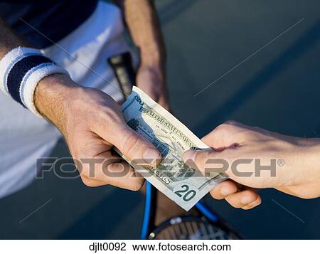 Paying for tennis lesson View Large Photo Image Stock Image - Paying for tennis lesson. Fotosearch