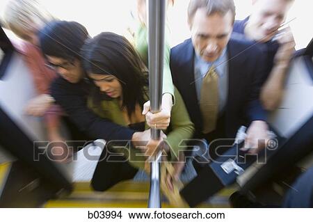 Picture - People entering city bus or subway. Fotosearch