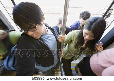 People entering city bus or subway View Large Photo Image Stock Photography - People entering city bus or subway. Fotosearch