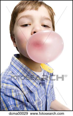 Stock Photo - Portait of boy blowing a bubblegum. Fotosearch