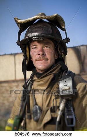 Stock Photograph - Portrait of a fire fighter. Fotosearch