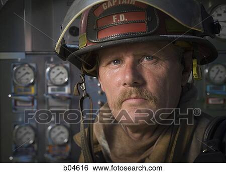 Portrait of a firefighter in front of control panel View Large Photo Image Stock Photograph - Portrait of a firefighter in front of control panel. Fotosearch