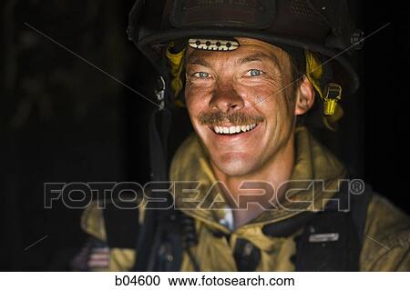 Portrait of a firefighter smiling View Large Photo Image Stock Image - Portrait of a firefighter smiling. Fotosearch