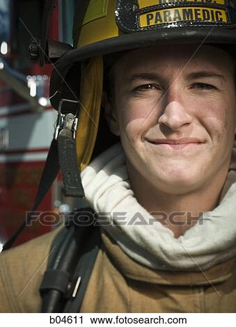 Stock Image - Portrait of a firefighter smiling. Fotosearch