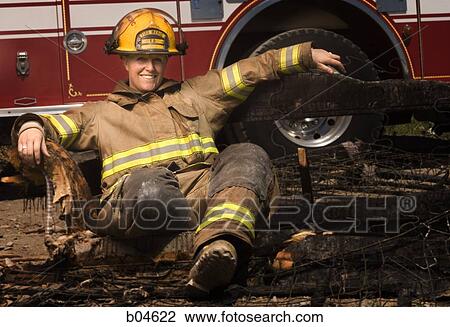 Portrait of a firefighter smiling View Large Photo Image Stock Image - Portrait of a firefighter smiling. Fotosearch