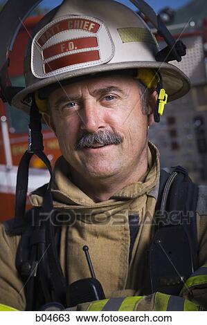 Portrait of a firefighter smiling View Large Photo Image Stock Image - Portrait of a firefighter smiling. Fotosearch