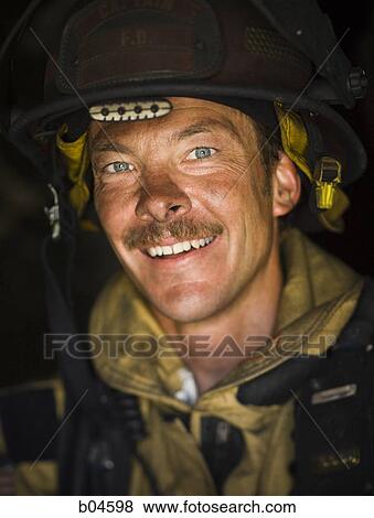 Portrait of a firefighter smiling View Large Photo Image Stock Photo - Portrait of a firefighter smiling. Fotosearch