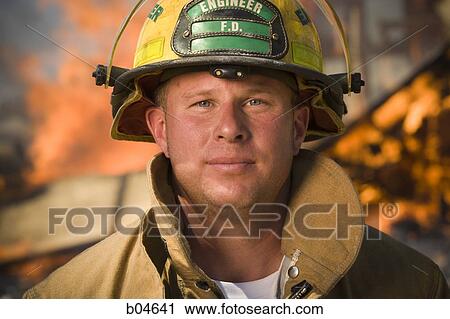 Portrait of a firefighter with fire in background View Large Photo Image Stock Image - Portrait of a firefighter with fire in background. Fotosearch