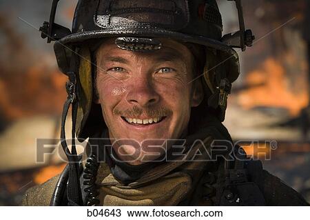 Portrait of a firefighter with fire in background View Large Photo Image Stock Image - Portrait of a firefighter with fire in background. Fotosearch