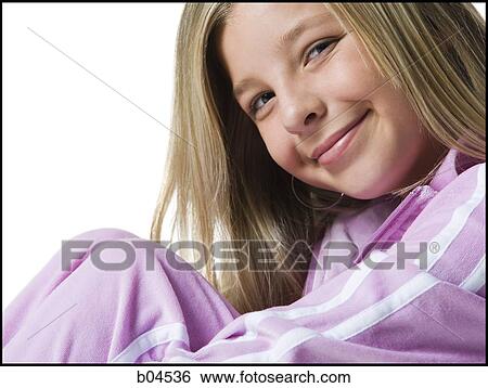 Stock Photograph - Portrait of a girl smiling closeup. Fotosearch