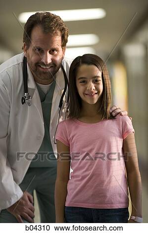 Portrait of a male doctor and girl View Large Photo Image Stock Image - Portrait of a male doctor and girl. Fotosearch