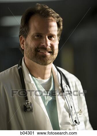 Portrait of a male doctor smiling View Large Photo Image Stock Image - Portrait of a male doctor smiling. Fotosearch