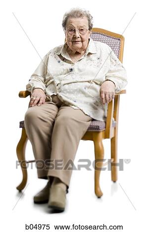 Portrait of a mature woman sitting in armchair View Large Photo Image Stock Photography - Portrait of a mature woman sitting in armchair. Fotosearch
