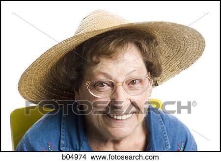 Portrait of a mature woman smiling with straw hat View Large Photo Image Picture - Portrait of a mature woman smiling with straw hat. Fotosearch