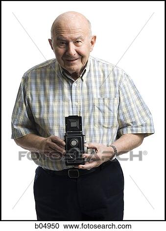 Portrait of an elderly man with old fashioned camera View Large Photo Image Stock Image - Portrait of an elderly man with old fashioned camera. Fotosearch