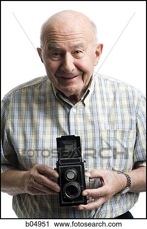 Portrait of an elderly man with old fashioned camera smiling View Large Photo Image Stock Image - Portrait of an elderly man with old fashioned camera smiling. Fotosearch