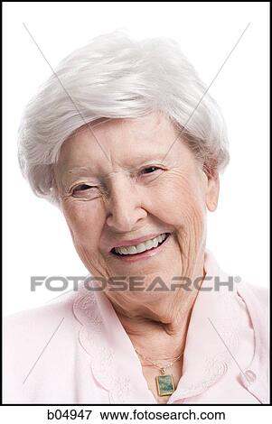 Portrait of an elderly woman smiling View Large Photo Image Stock Photo - Portrait of an elderly woman smiling. Fotosearch