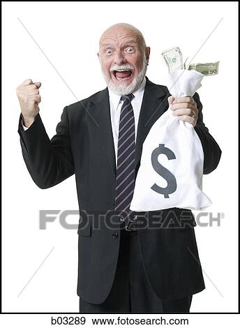 Stock Photo - Portrait of businessman holding money bag. Fotosearch