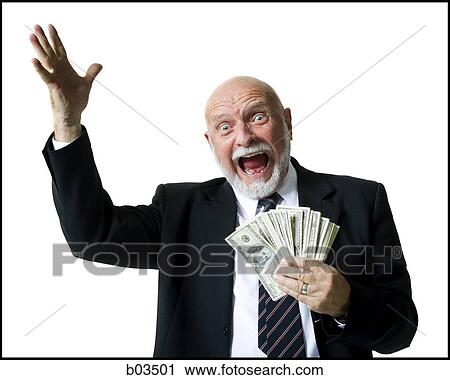 Stock Image - Portrait of businessman holding US banknotes. Fotosearch