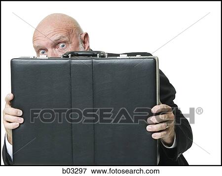Stock Photo - Portrait of businessman with briefcase. Fotosearch