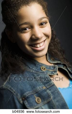 Portrait of girl smiling in denim jacket View Large Photo Image Stock Photograph - Portrait of girl smiling in denim jacket. Fotosearch