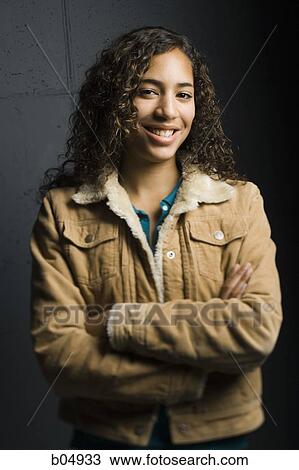 Portrait of girl smiling with arms crossed View Large Photo Image Stock Image - Portrait of girl smiling with arms crossed. Fotosearch