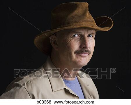 Portrait of man in hat View Large Photo Image Stock Photo - Portrait of man in hat. Fotosearch