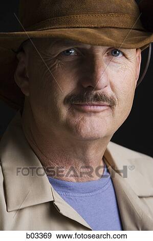 Stock Photo - Portrait of man in hat. Fotosearch