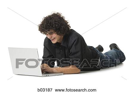 Stock Photo - Portrait of man with laptop. Fotosearch