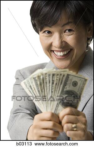 Portrait of woman holding US banknotes View Large Photo Image Stock Image - Portrait of woman holding US banknotes. Fotosearch