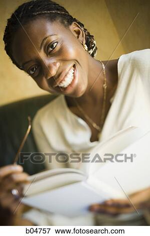 Portrait of woman with glasses reading View Large Photo Image Stock Photo - Portrait of woman with glasses reading. Fotosearch