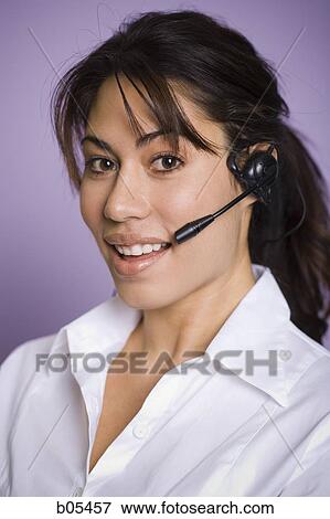 Portrait of woman with headset View Large Photo Image Stock Photo - Portrait of woman with headset. Fotosearch