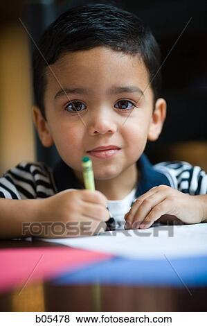 Portrait of young boy coloring View Large Photo Image Stock Photo - Portrait of young boy coloring. Fotosearch